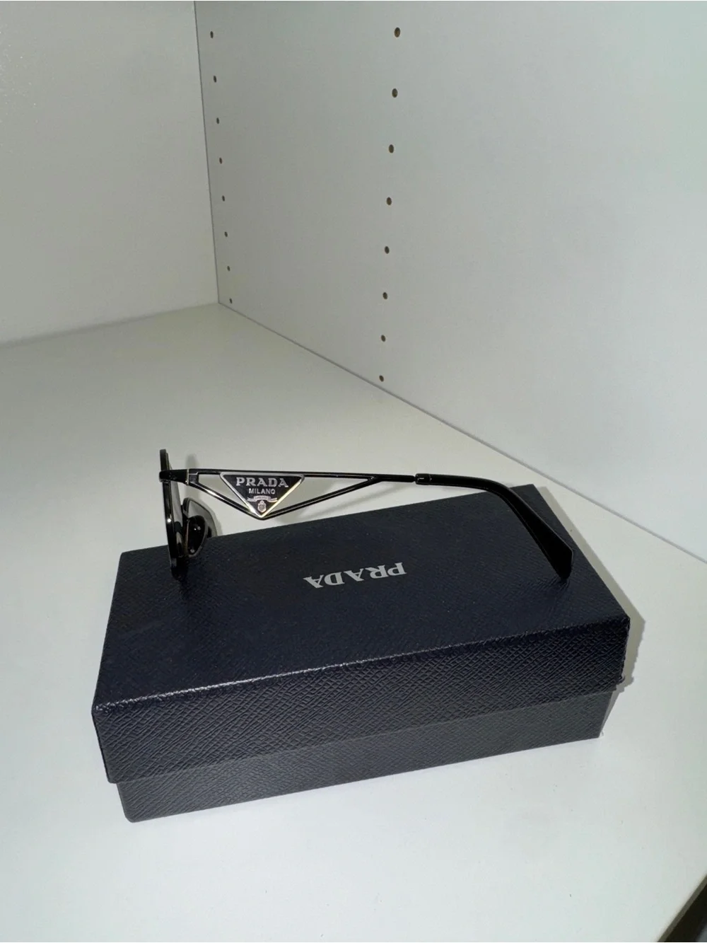 Prada Women’s Black Metal Frame Sunglasses with Dark Lenses